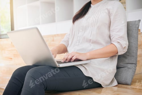 Preview: Young Business Woman Sitting In Modern Office, Working On A Laptop Computer And Planning A New