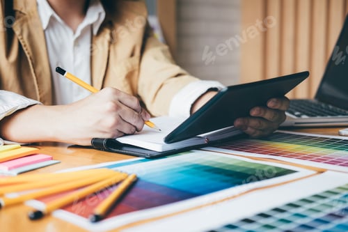 Preview: Creative Graphic Designer Using Graphics Tablet To Choosing Color Swatch Samples Chart For