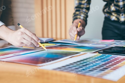 Preview: Young Creative Team Having A Meeting In Creative Office, Architectural Drawing With Work Tools And