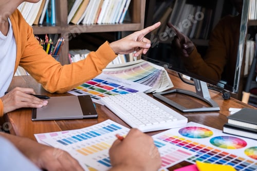Preview: Two Colleague Creative Graphic Designer Working On Color Selection And Color Swatches, Drawing On