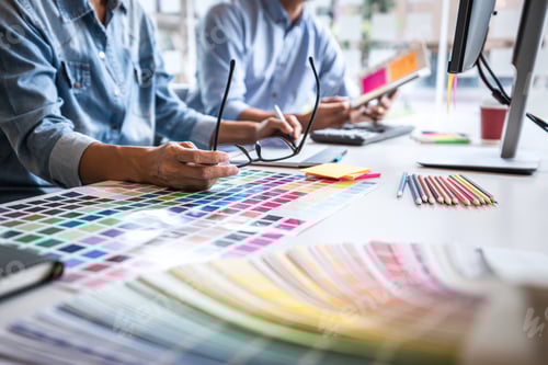 Preview: Two Colleague Creative Graphic Designer Working On Color Selection And Color Swatches, Drawing On