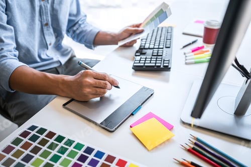 Preview: Image Of Male Creative Graphic Designer Working On Color Selection And Drawing On Graphics Tablet