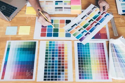 Preview: Young Creative Graphic Designer Using Graphics Tablet To Choosing Color Swatch Samples Chart For