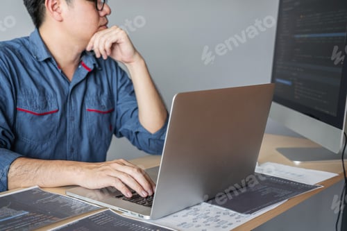 Preview: Young Professional Programmer Working At Developing Programming And Website Working In A Software