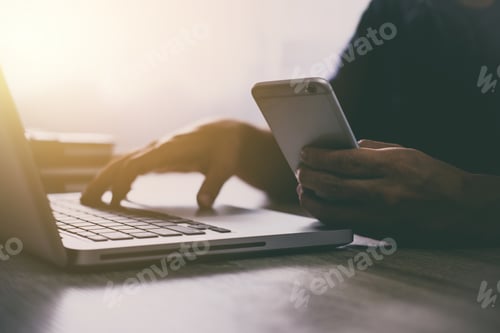 Preview: Man Typing Laptop And Using Smartphone For Online Shopping And Pay By Credit Card, Online Payment