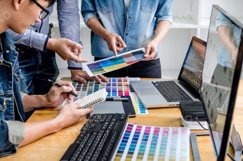 Preview: Team Of Young Colleagues Creative Graphic Designer Working On Color Selection And Drawing On