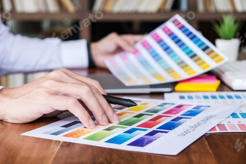 Preview: Image Of Male Creative Graphic Designer Working On Color Selection And Drawing On Graphics Tablet