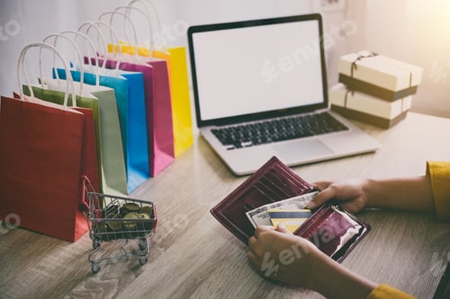 Preview: Image Of Young Woman Giving Credit Card From Wallet For Online Shopping And Pay By Credit Card