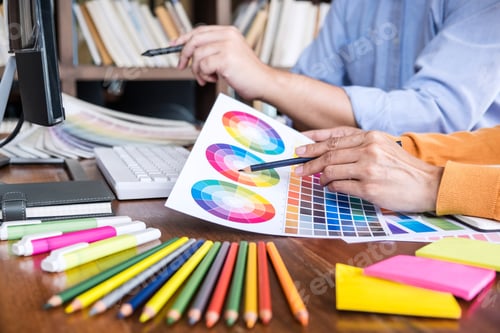 Preview: Two Colleagues Creative Graphic Designer Working On Color Selection And Drawing On Graphics Tablet