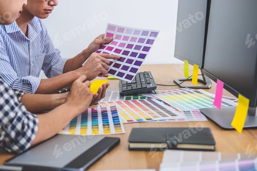 Preview: Two Colleagues Creative Graphic Designer Working On Color Selection And Drawing On Graphics Tablet