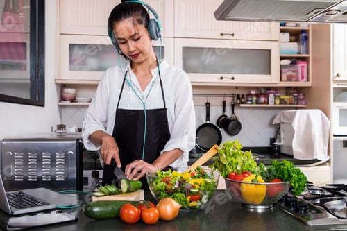 Preview: Young Happiness Woman Cooking Vegetables Salad In The Kitchen, Healthy Food Concept.