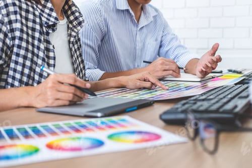 Preview: Two Colleague Creative Graphic Designer Working On Color Selection And Color Swatches, Drawing On