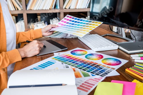 Preview: Image Of Female Creative Graphic Designer Working On Color Selection And Drawing On Graphics Tablet