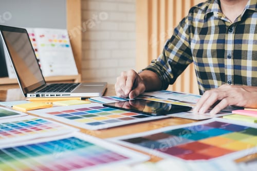 Preview: Creative Graphic Designer Using Graphics Tablet To Choosing Color Swatch Samples Chart For