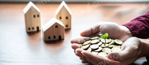 Preview: Plant Sprouting Growing On Pile Of Coins In Hands Asian Businessman With House Model On Table To