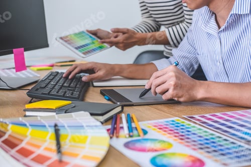 Preview: Young Creative Team Having A Meeting In Creative Office, Architectural Drawing With Work Tools And