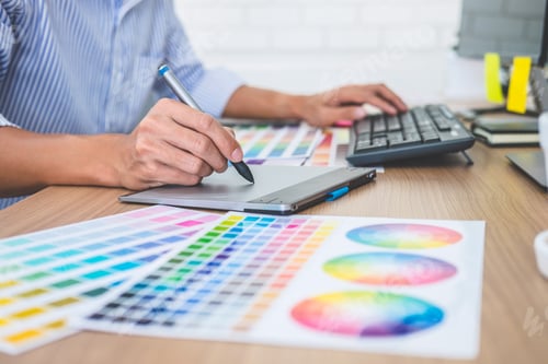 Preview: Image Of Male Creative Graphic Designer Working On Color Selection And Drawing On Graphics Tablet