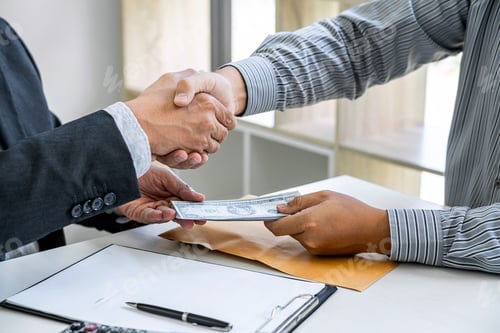 Preview: Bribery And Corruption Concept, Bribe In The Form Of Dollar Bills, Businessman Shaking Hands And