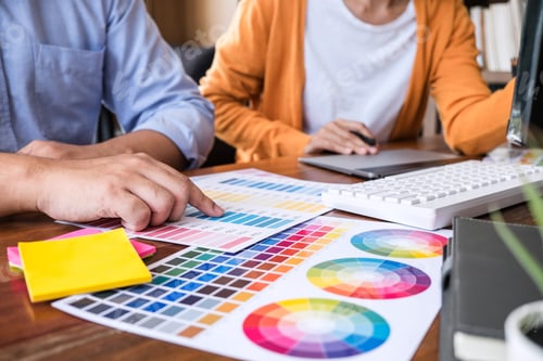 Preview: Two Colleagues Creative Graphic Designer Working On Color Selection And Drawing On Graphics Tablet