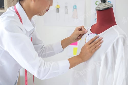 Preview: Young Woman Dressmaker Or Designer Working As Fashion Designers Measure And Repairing Clothes And