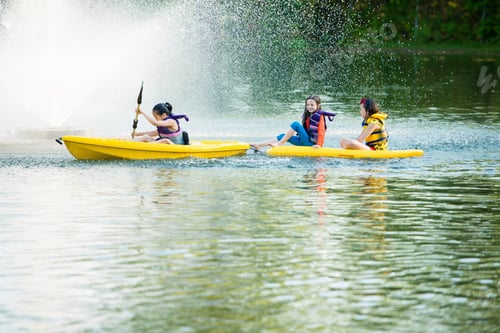 Preview: Girls Canoeing On Lake