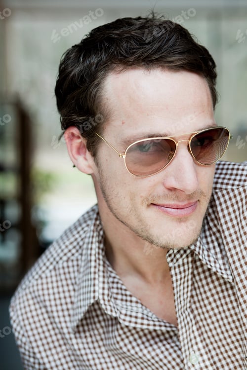 Preview: Man With Sunglasses Smiling At Viewer