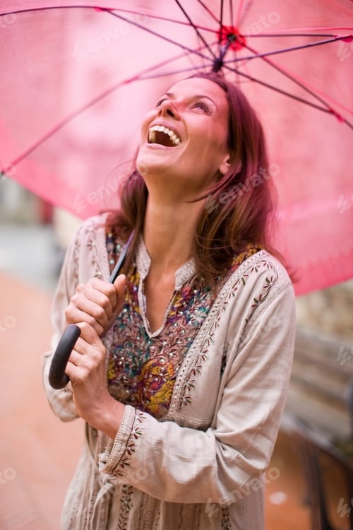 Preview: Woman Under Pink Umbrella Laughing