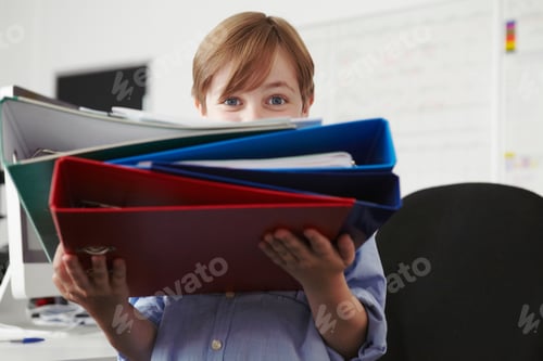 Preview: Boy Holding Pile Of Ring Binders