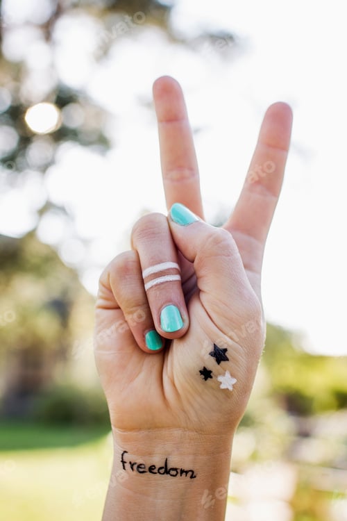Preview: Woman Making Peace Sign With Hand