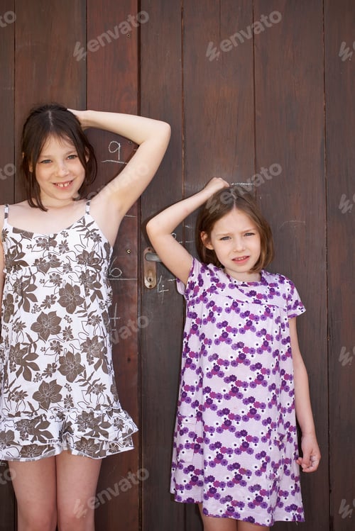 Preview: Young Girls Measuring Themselves