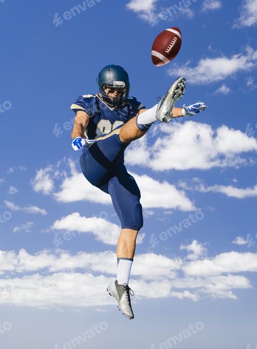 Preview: American Football Player Jumping And Kicking Ball