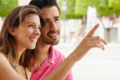 Preview: Attractive Young Couple In City Square