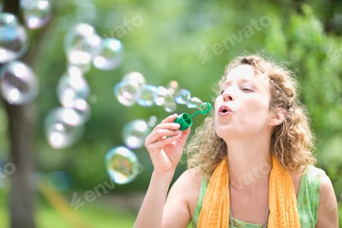 Preview: Young Woman Blowing Bubbles