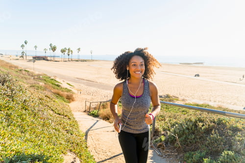 Preview: Mid Adult Woman Running Along Pathway By Beach