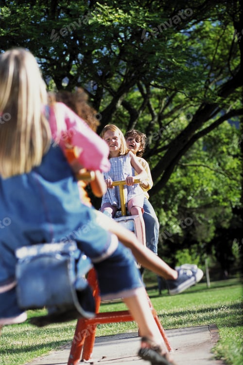 Preview: Children Playing On A Seesaw