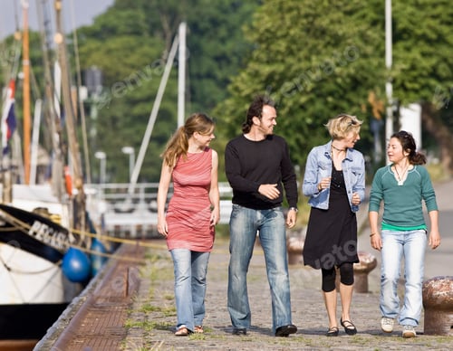 Preview: Man And Women Walking On A Pier