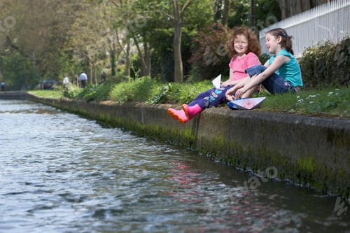 Preview: Girls Sitting On Riverbank Together