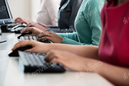 Preview: Businesswomen Working At Computers
