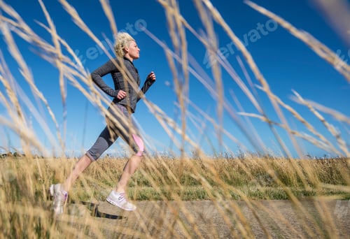 Preview: Young Woman Jogging, View Through Grass