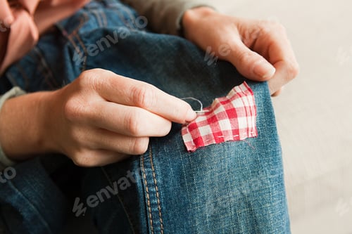 Preview: Woman Repairing Jeans, Close Up