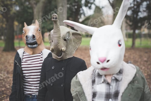Preview: Three Sisters Wearing Animal Masks Posing In Park