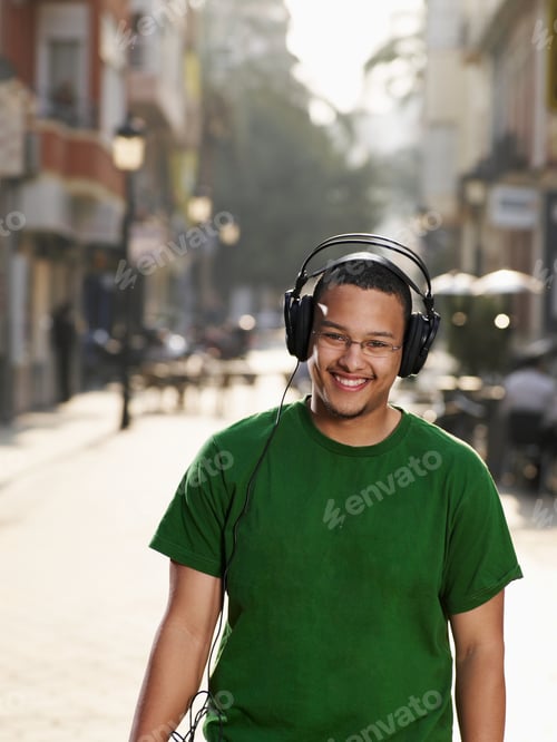 Preview: Young Man In Street Wearing Headphones