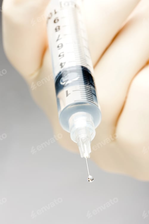 Preview: A Doctor Holding A Syringe