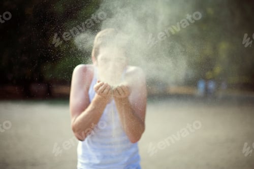 Preview: Man Blowing Sand