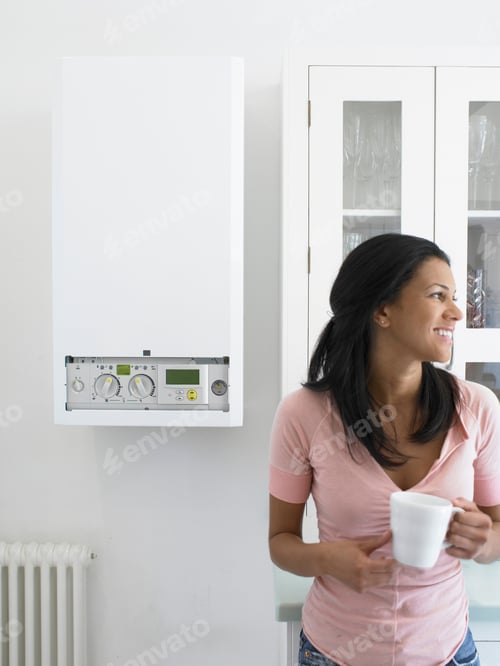 Preview: Woman Having Cup Of Coffee In Kitchen