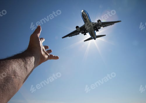 Preview: Hand Reaching For Aeroplane In Sky
