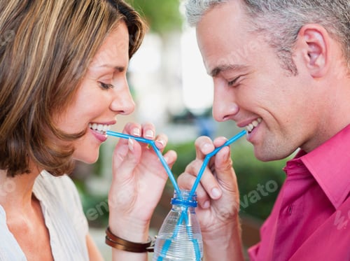 Preview: Couple Drinking Out Of Same Glass