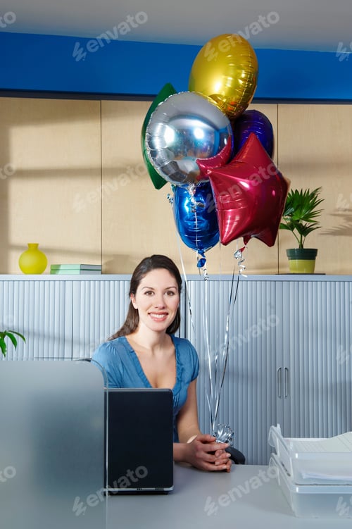 Preview: Young Woman With Balloons At Desk