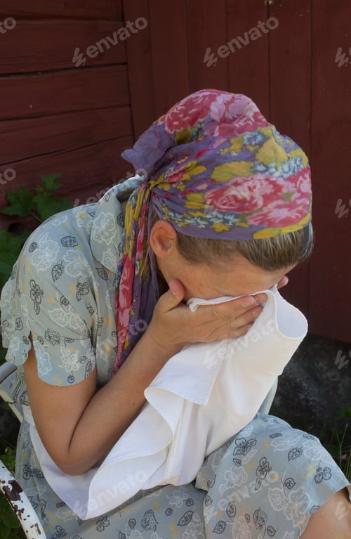 Preview: Woman Wiping Her Face Outdoors