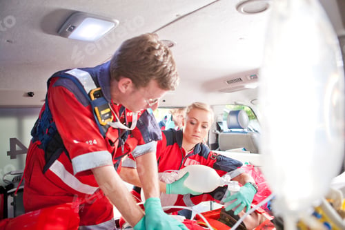 Preview: Paramedics Giving Patient Heart Massage In Ambulance